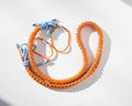 Orange and blue Bubzi paracord camera strap with metal carabiners on a white background