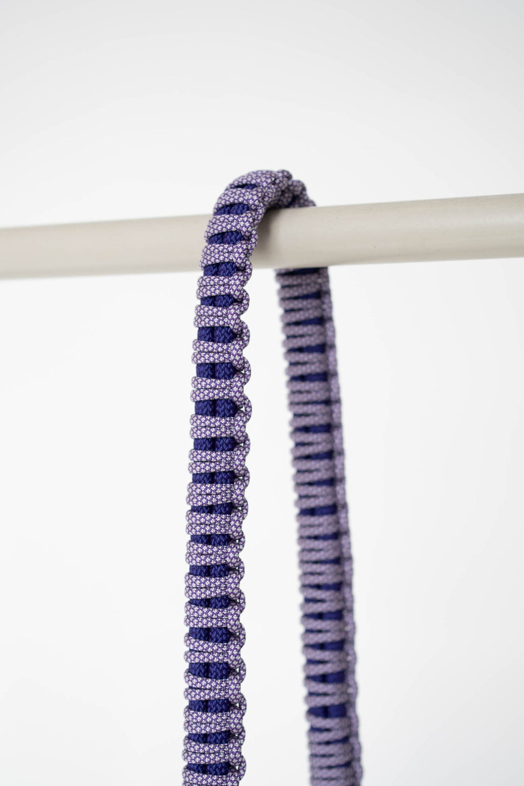 Close-up of the purple snake print pattern on the Bubzi camera strap