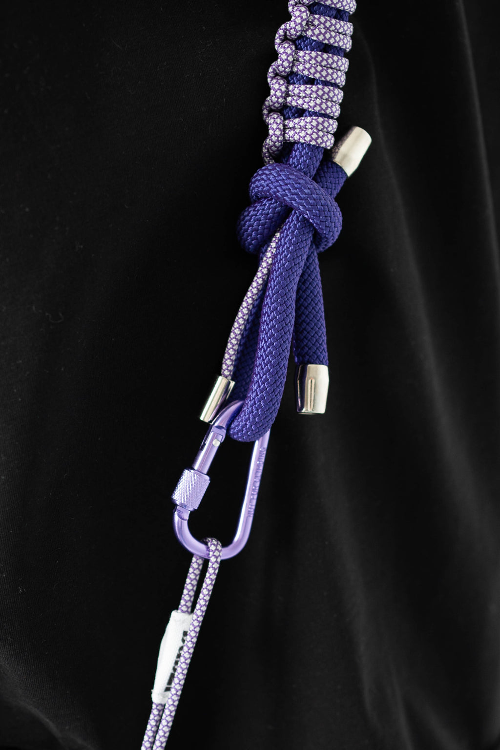 Purple Bubzi camera strap styled as a bright accessory for everyday photo shoots