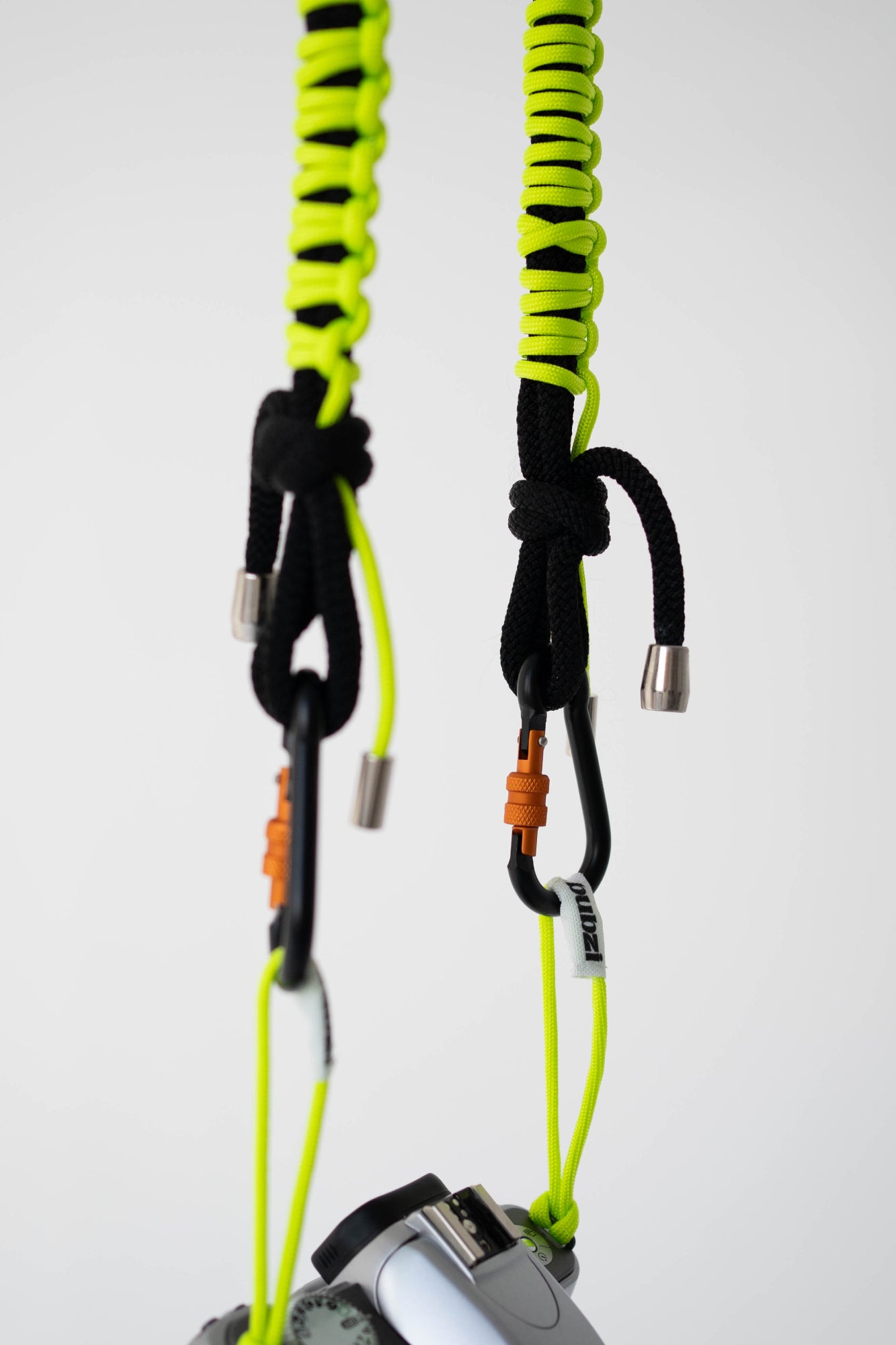 Close-up of the black and lime paracord weave on the Bubzi camera strap