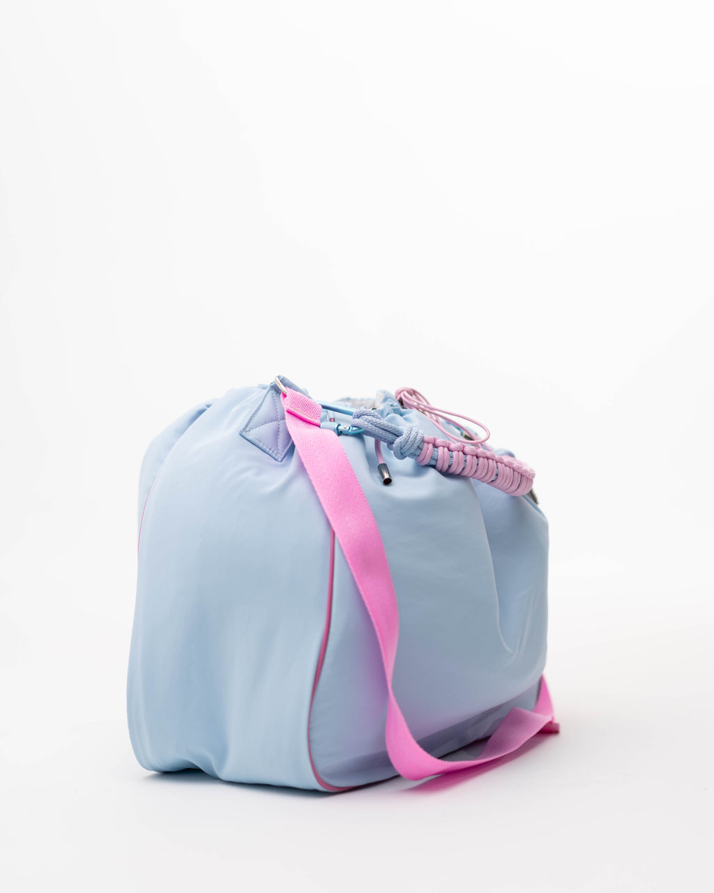 Light blue Maxi Bubzi bag with a pink shoulder strap in side view.
