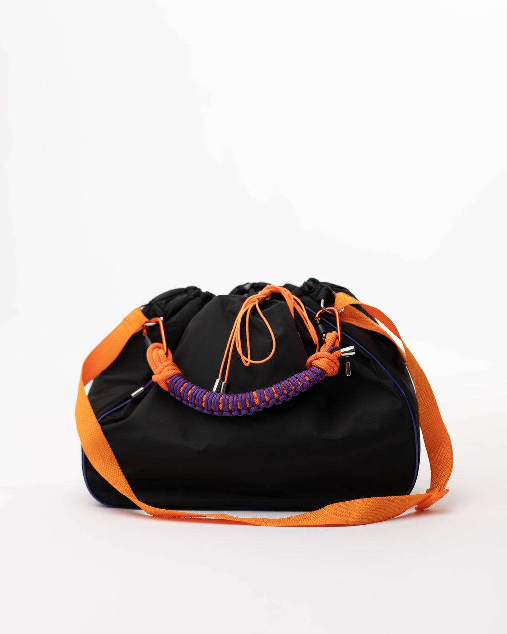 Black Maxi Bubzi bag with orange shoulder strap and purple braided handle on a white background