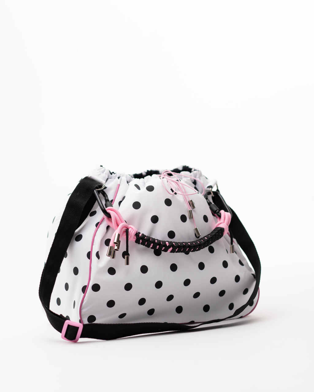 Polka dot Maxi Bubzi bag with a black shoulder strap and pink accents.
