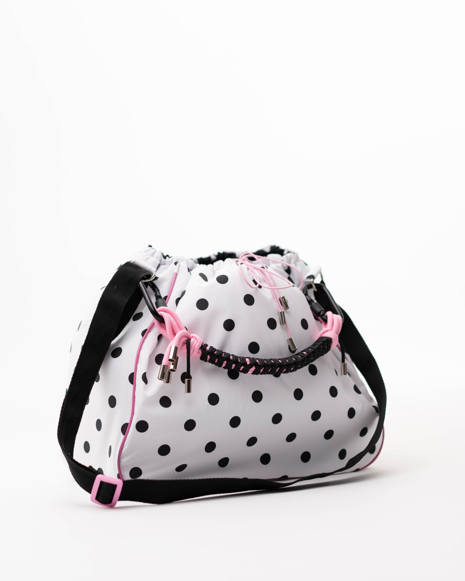 Polka dot Maxi Bubzi bag with a black shoulder strap and pink accents.