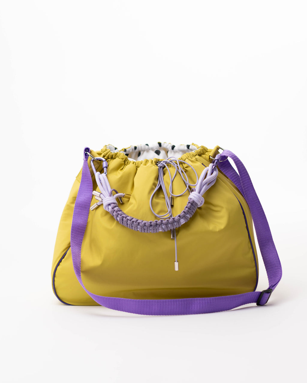 Lime Maxi Bubzi bag with a purple shoulder strap and a braided handle.