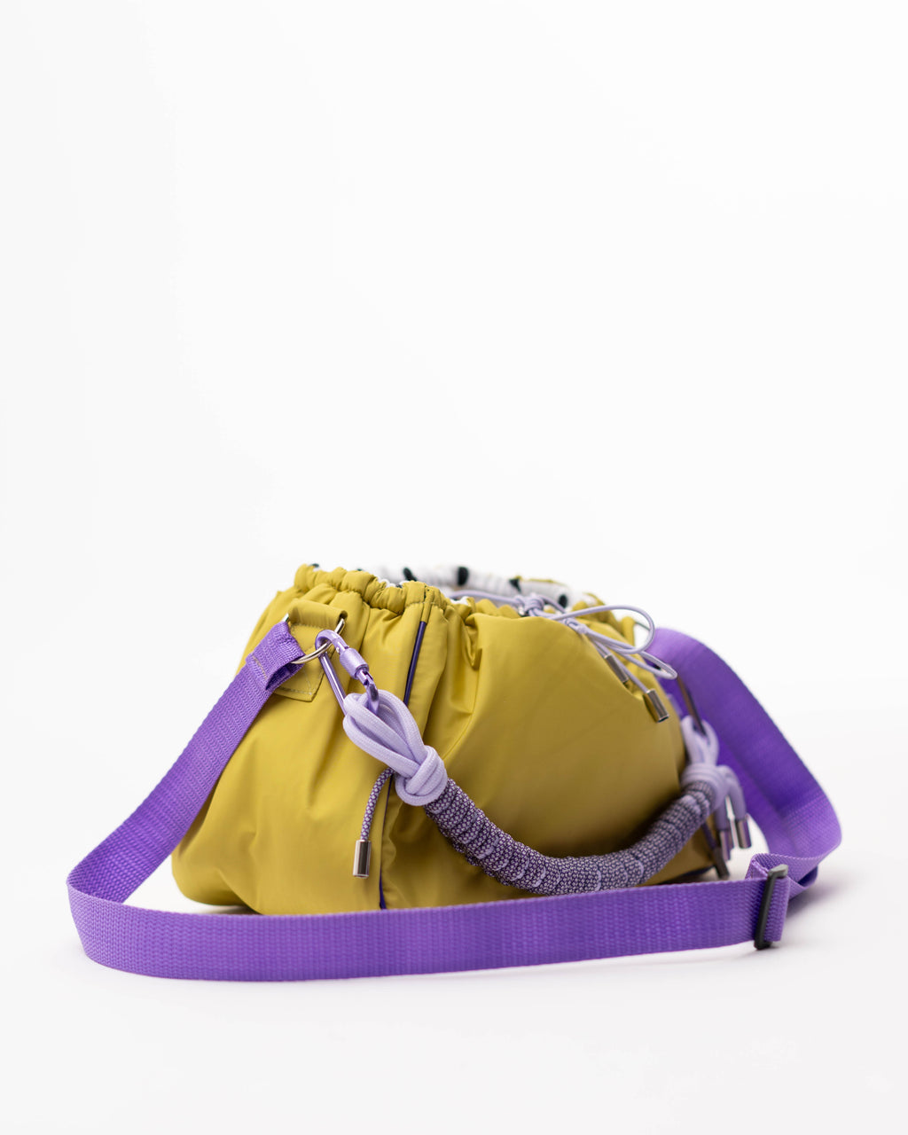 Lime Mini Bubzi bag with purple shoulder strap, braided paracord handle, and drawstring closure