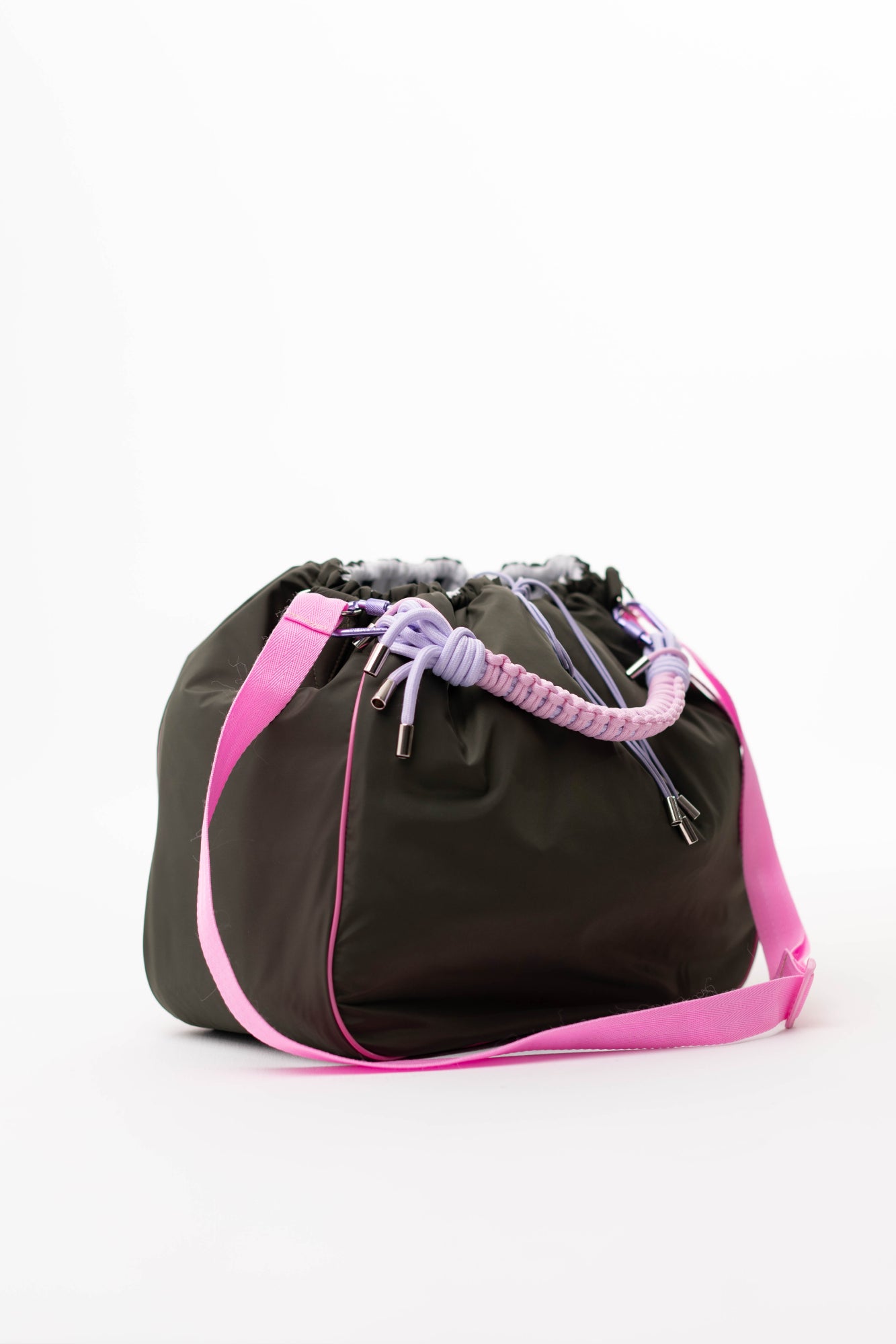 Side view of the khaki Maxi Bubzi bag with a pink shoulder strap