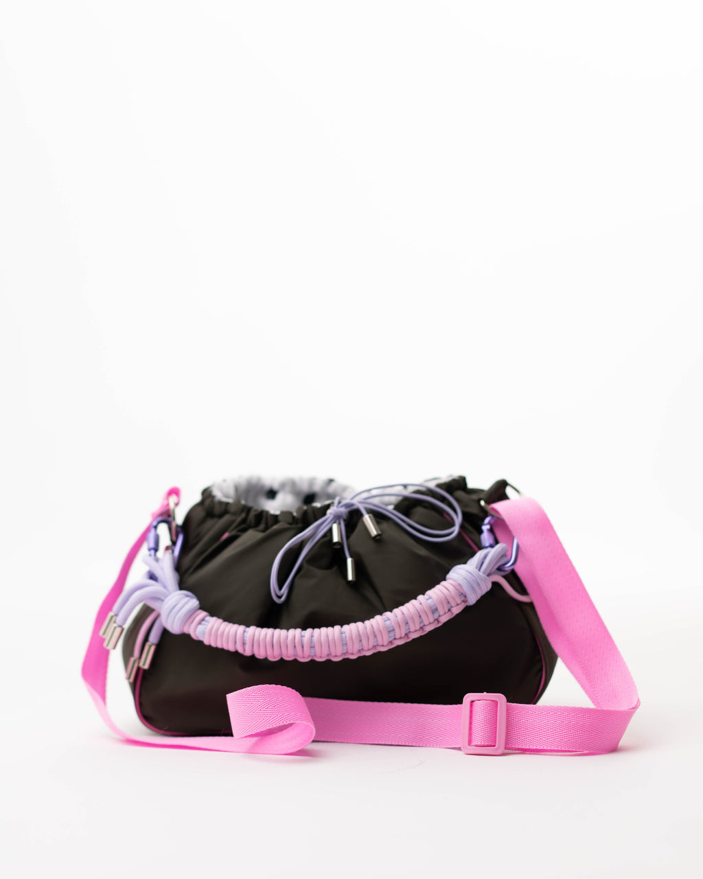 Khaki Mini Bubzi bag with pink shoulder strap, braided paracord handle, and drawstring closure