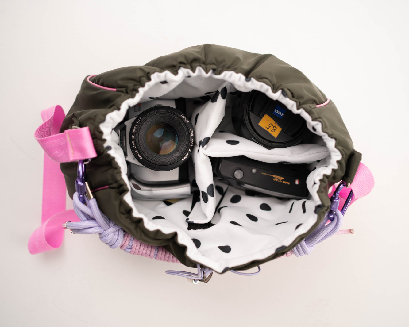 Khaki Mini Bubzi camera bag with padded compartments for a camera, lens, and accessories