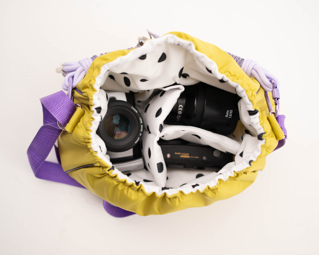 Lime Mini Bubzi camera bag with padded compartments for a camera, lens, and accessories