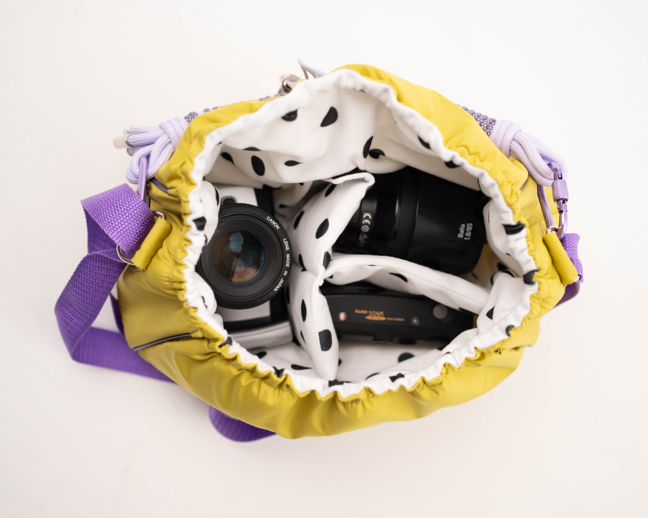 Lime Mini Bubzi camera bag with padded compartments for a camera, lens, and accessories