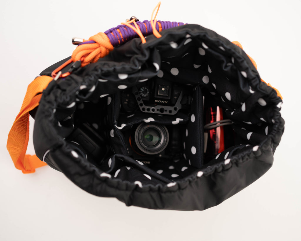 Black Maxi Bubzi camera bag with padded compartments for a camera, lenses, and accessories