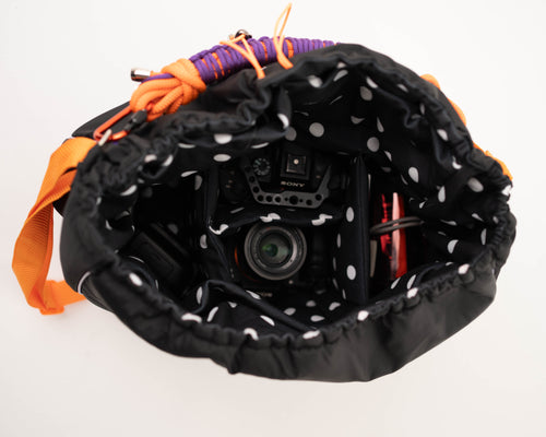 Black Maxi Bubzi camera bag with padded compartments for a camera, lenses, and accessories