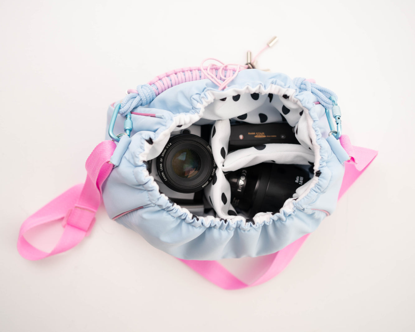 Blue Mini Bubzi camera bag with padded compartments for a camera, lens, and accessories